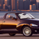 A convertible Crysler PT Cruiser in purple